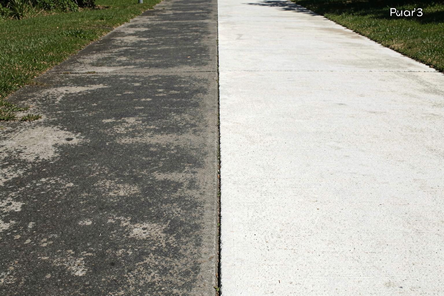 Concrete walkway half cleaned by pressure washing